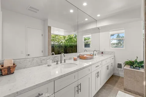 a view of a patio with table and chairs and wooden floor