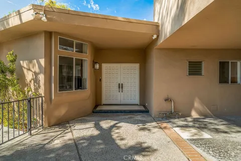 a view of a refrigerator and a kitchen