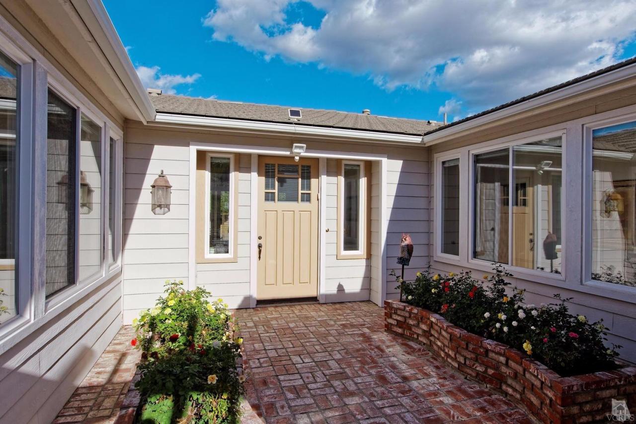 3248 Bluebird Circle Simi Valley, CA 93063 - Photo 2 of 28 a view of a house with a flower garden