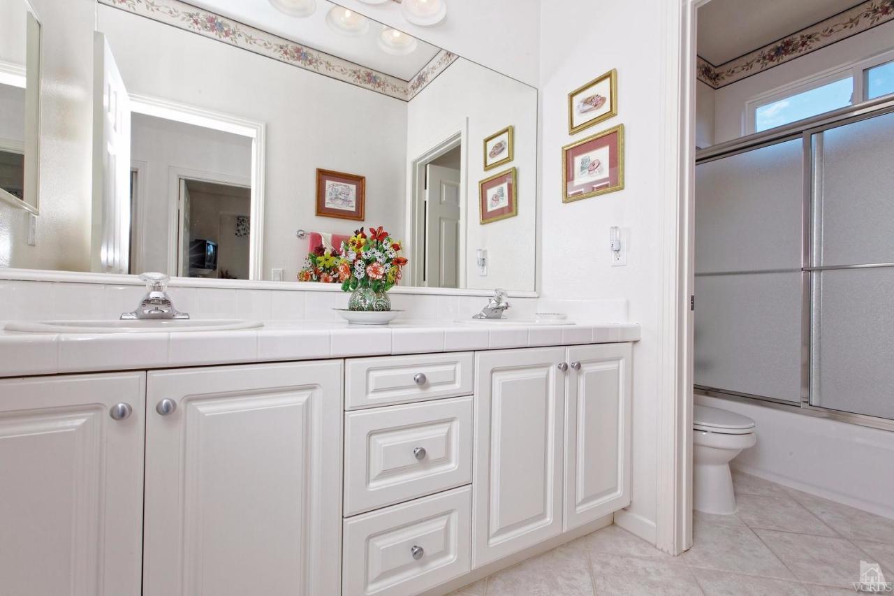 3248 Bluebird Circle Simi Valley, CA 93063 - Photo 14 of 28 a bathroom with a double vanity sink mirror and toilet