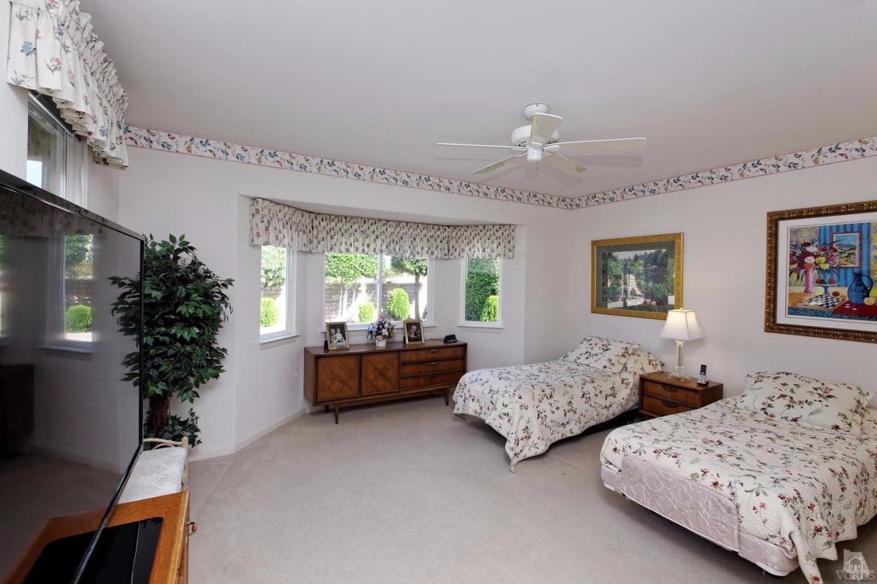 3248 Bluebird Circle Simi Valley, CA 93063 - Photo 16 of 28 a bedroom with two beds and a potted plant