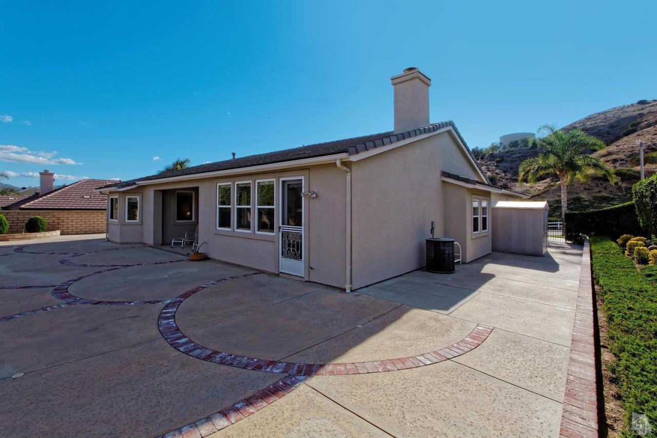 3248 Bluebird Circle Simi Valley, CA 93063 - Photo 24 of 28 a view of a house with a backyard