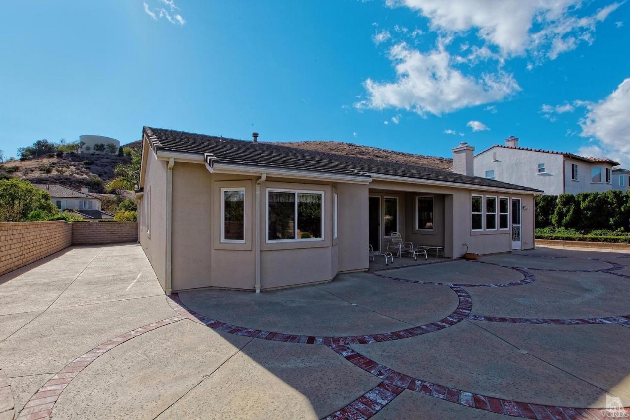 3248 Bluebird Circle Simi Valley, CA 93063 - Photo 27 of 28 a front view of a house with a garden