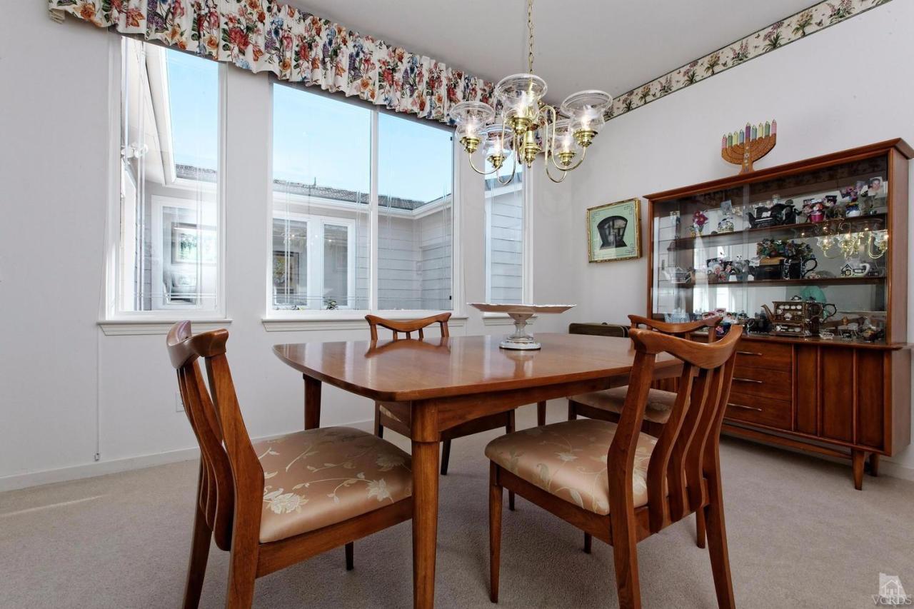3248 Bluebird Circle Simi Valley, CA 93063 - Photo 4 of 28 a view of a dining room with furniture a chandelier and window