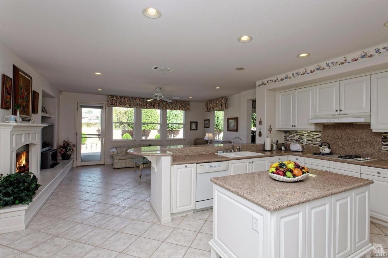 3248 Bluebird Circle Simi Valley, CA 93063 - Photo 6 of 28 a kitchen with a sink cabinets and window