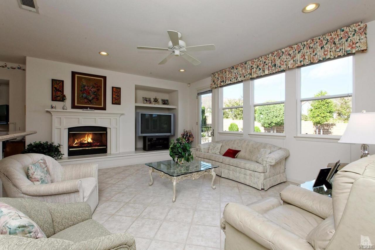 3248 Bluebird Circle Simi Valley, CA 93063 - Photo 9 of 28 a living room with furniture and a fireplace