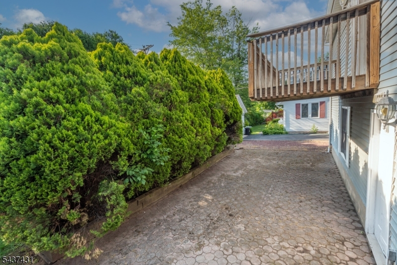 20 Wanaque Road West Milford, NJ 07421 - Photo 22 of 31 a view of a pathway of a house with wooden fence