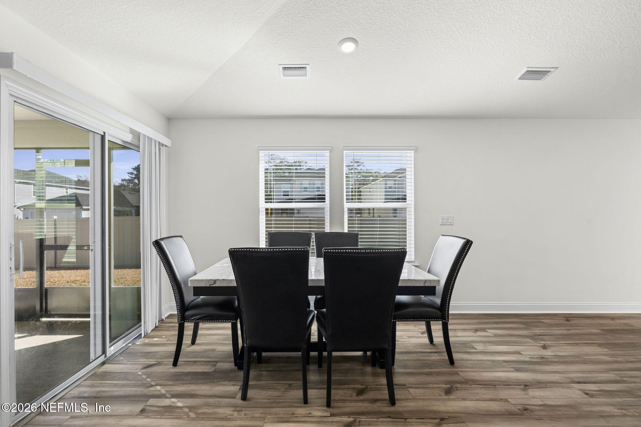 277 Rambling Brk Trail St. Johns, FL 32259 - Photo 12 of 51 a view of a dining room with furniture and wooden floor