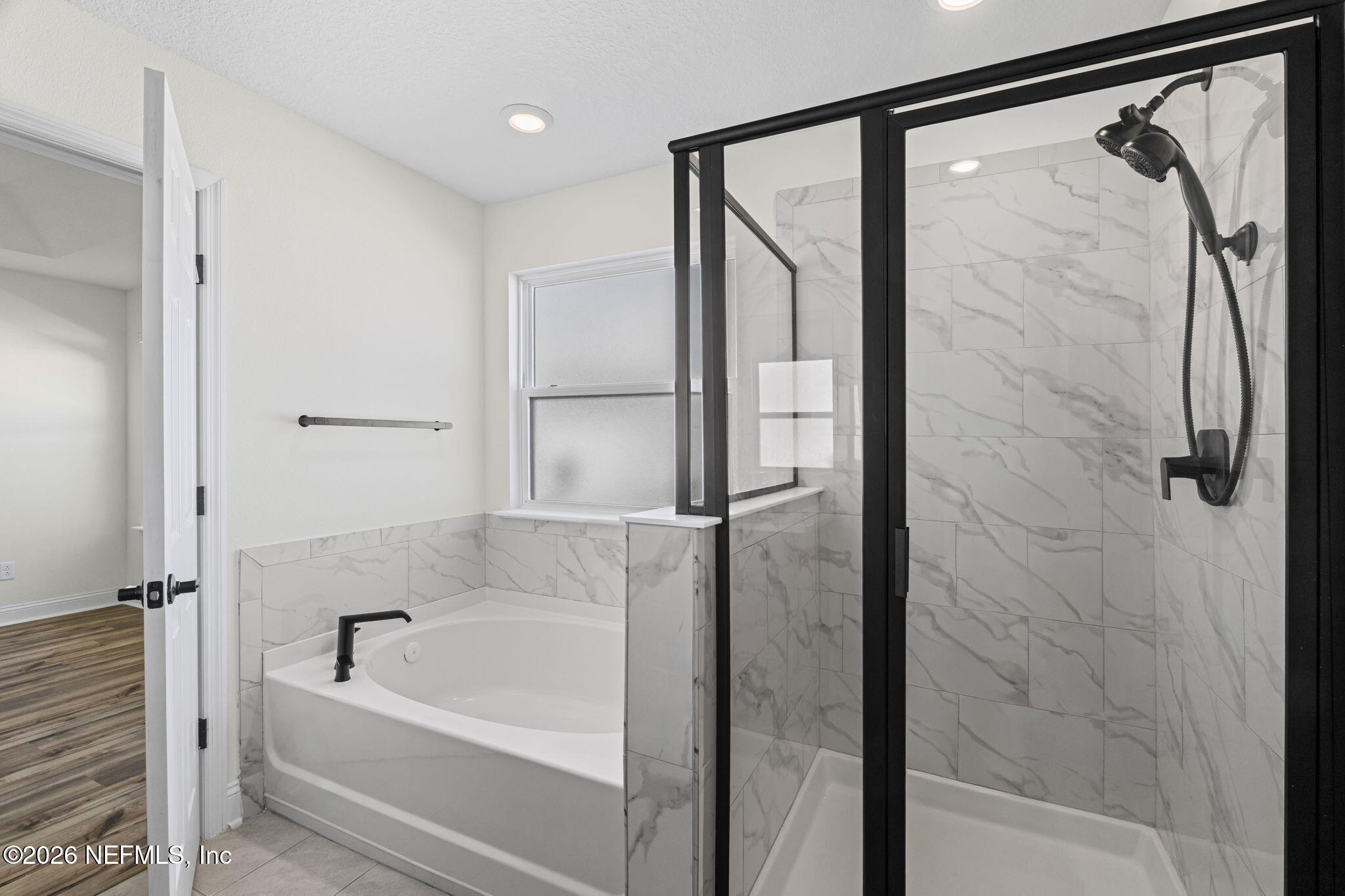 277 Rambling Brk Trail St. Johns, FL 32259 - Photo 19 of 51 a bathroom with a bathtub and a shower