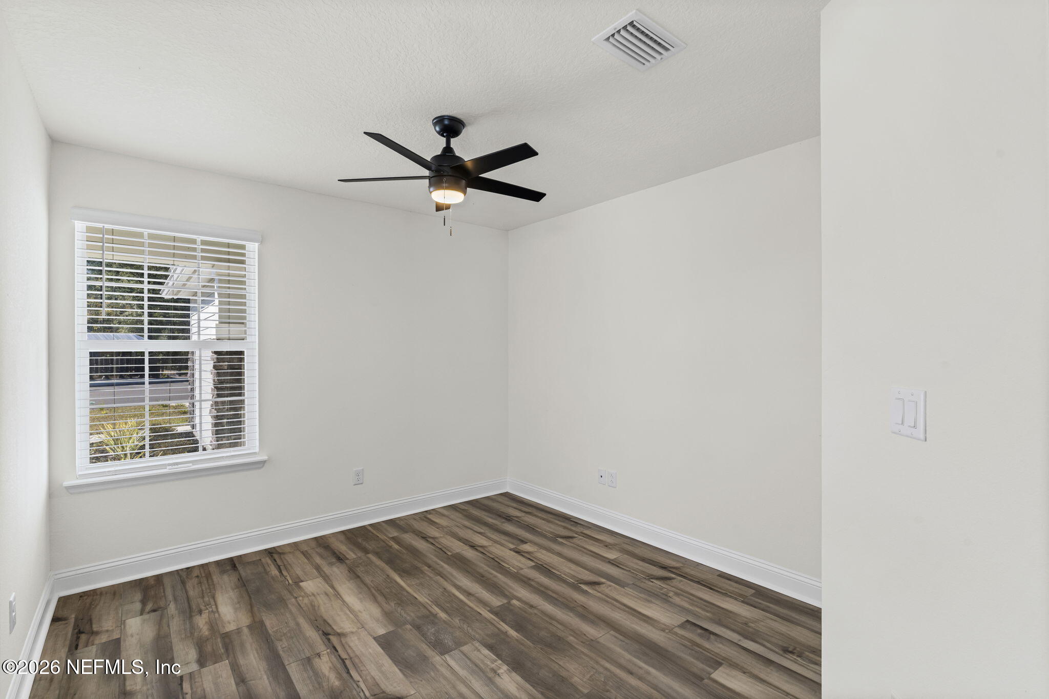 277 Rambling Brk Trail St. Johns, FL 32259 - Photo 22 of 51 a view of empty room with wooden floor and fan