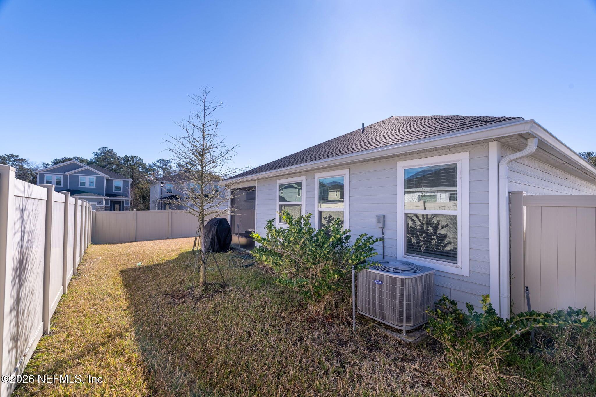 277 Rambling Brk Trail St. Johns, FL 32259 - Photo 33 of 51 a front view of house with yard and trees in the background