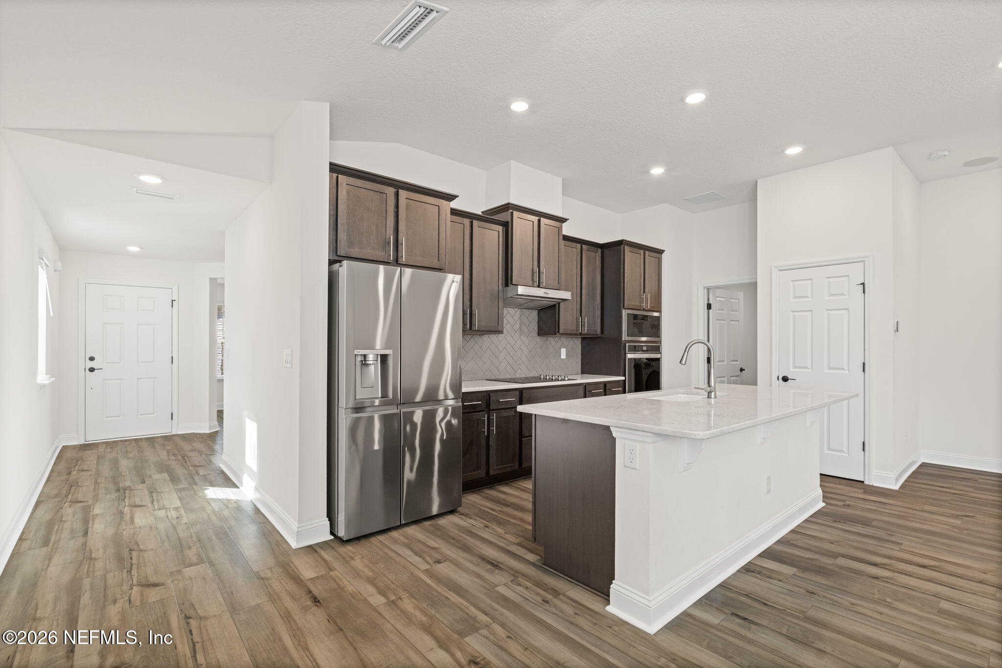 277 Rambling Brk Trail St. Johns, FL 32259 - Photo 5 of 51 a kitchen with stainless steel appliances a refrigerator and a stove top oven
