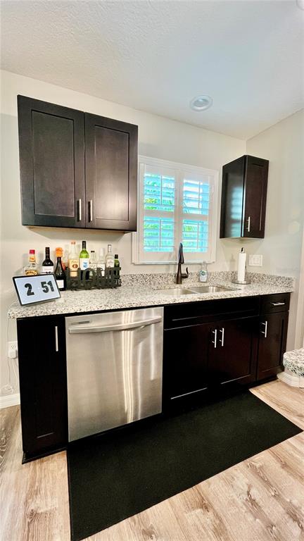 13486 English Sparrow Road Weeki Wachee, FL 34614 - Photo 14 of 51 a kitchen with a sink a stove and cabinets