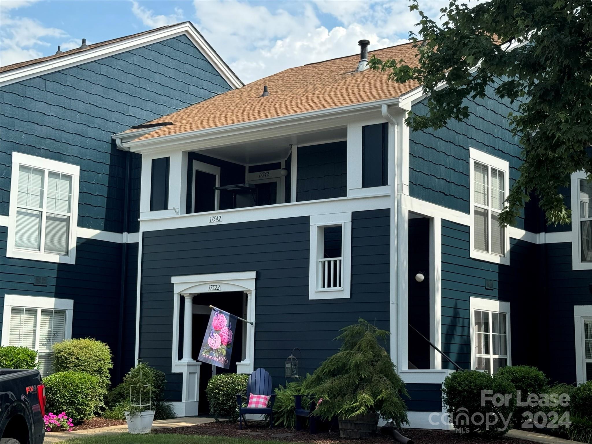 a front view of house with an outdoor space