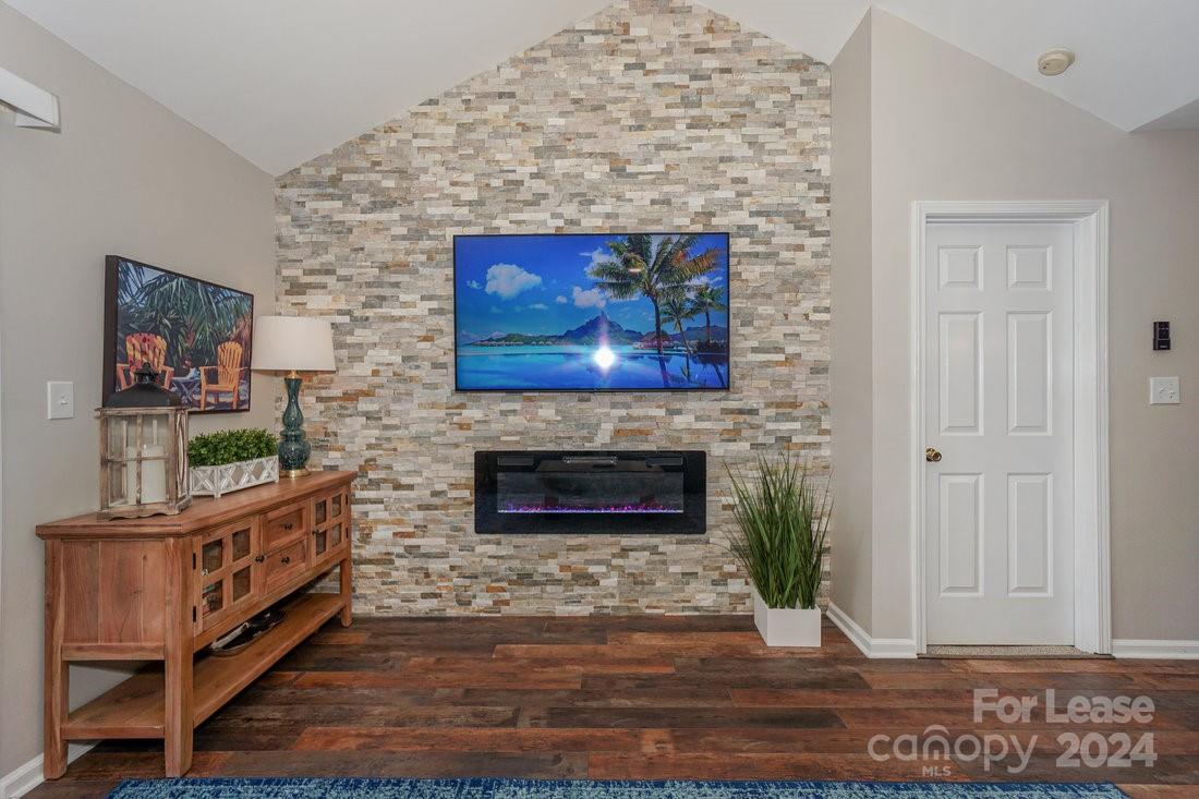 17542 Tuscany Lane Cornelius, NC 28031 - Photo 12 of 35 a living room with furniture and a fireplace