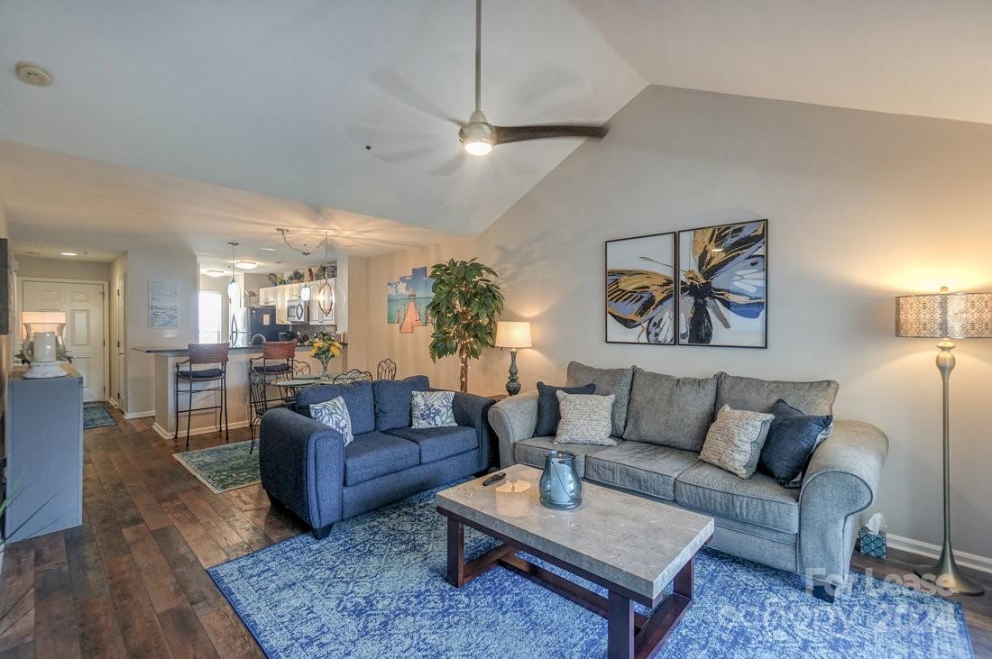 17542 Tuscany Lane Cornelius, NC 28031 - Photo 16 of 35 a living room with furniture or couch and a painting on the wall