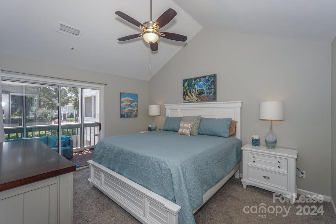 17542 Tuscany Lane Cornelius, NC 28031 - Photo 17 of 35 a bedroom with a bed and a table