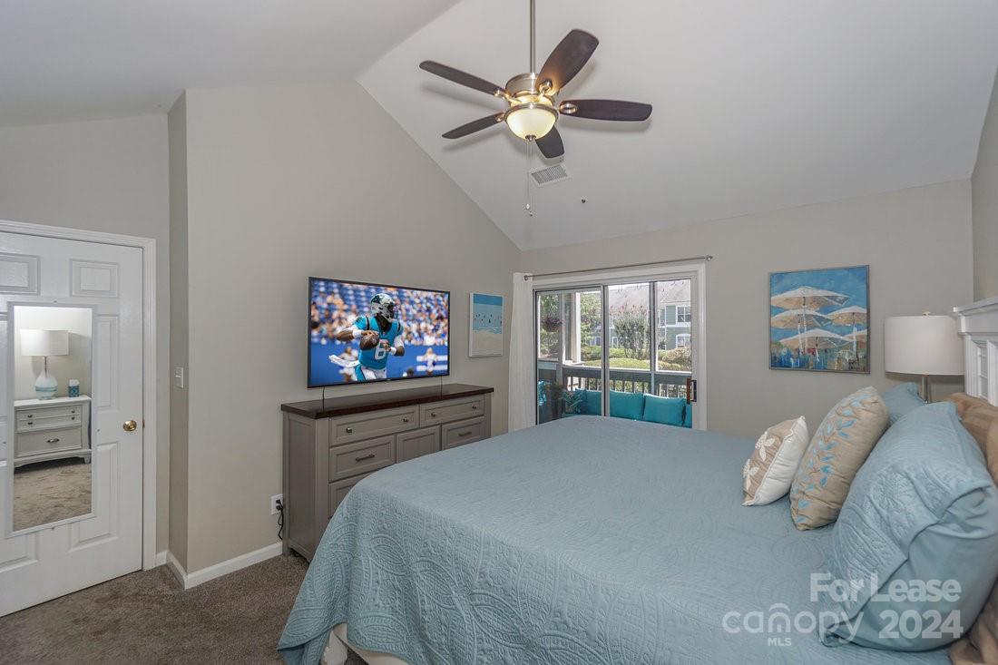 17542 Tuscany Lane Cornelius, NC 28031 - Photo 18 of 35 a bedroom with a large bed and a window