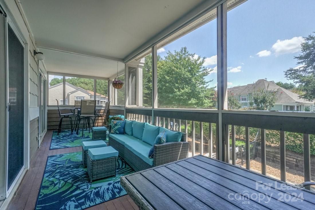 17542 Tuscany Lane Cornelius, NC 28031 - Photo 28 of 35 a balcony with wooden floor and outdoor space