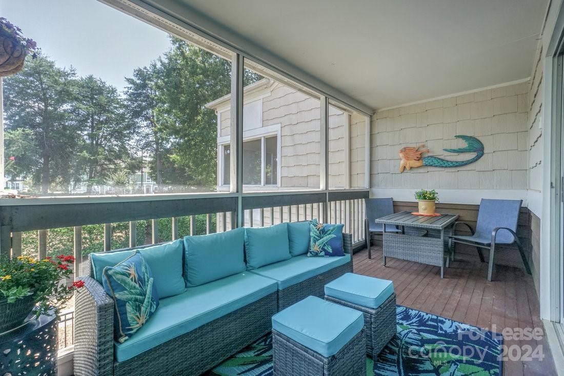 17542 Tuscany Lane Cornelius, NC 28031 - Photo 30 of 35 a roof deck with couches and potted plants