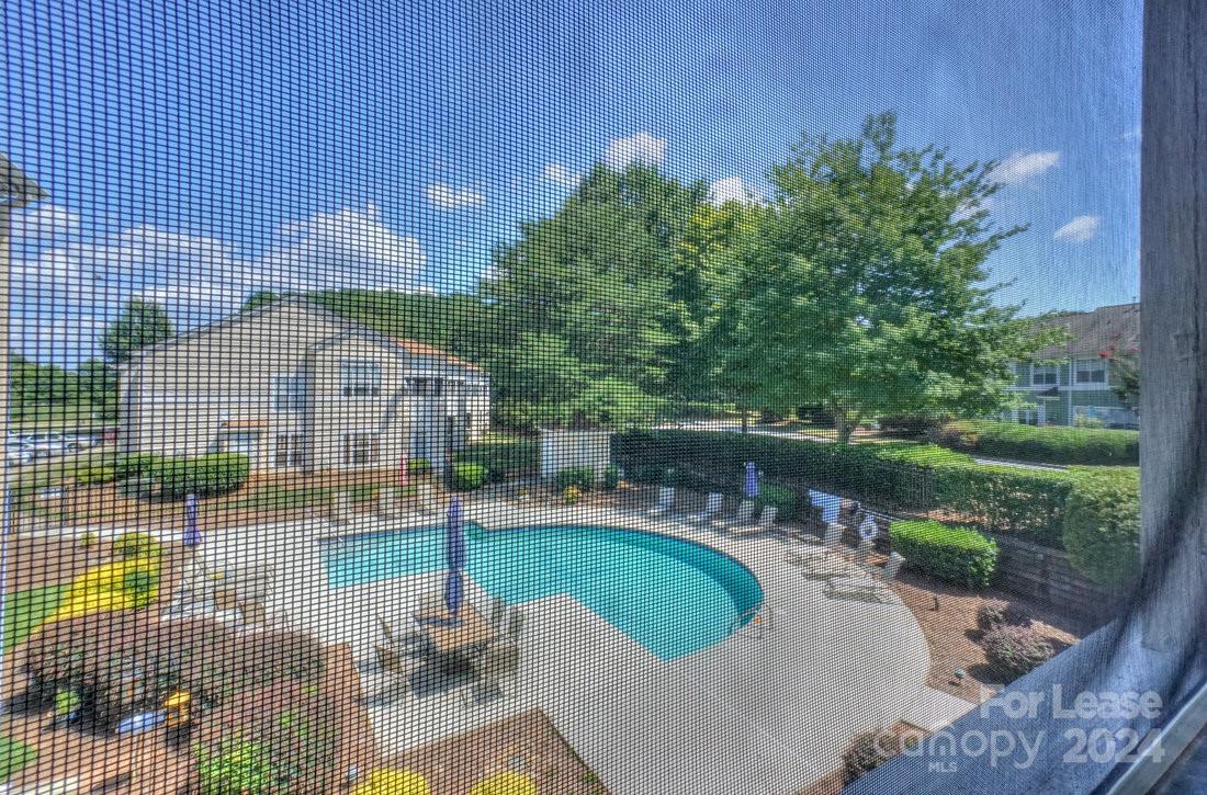 17542 Tuscany Lane Cornelius, NC 28031 - Photo 31 of 35 a swimming pool with outdoor space and seating area