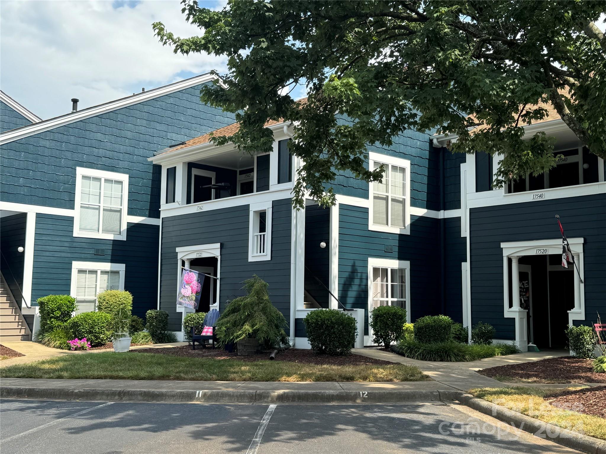 17542 Tuscany Lane Cornelius, NC 28031 - Photo 32 of 35 a view of a house with a yard