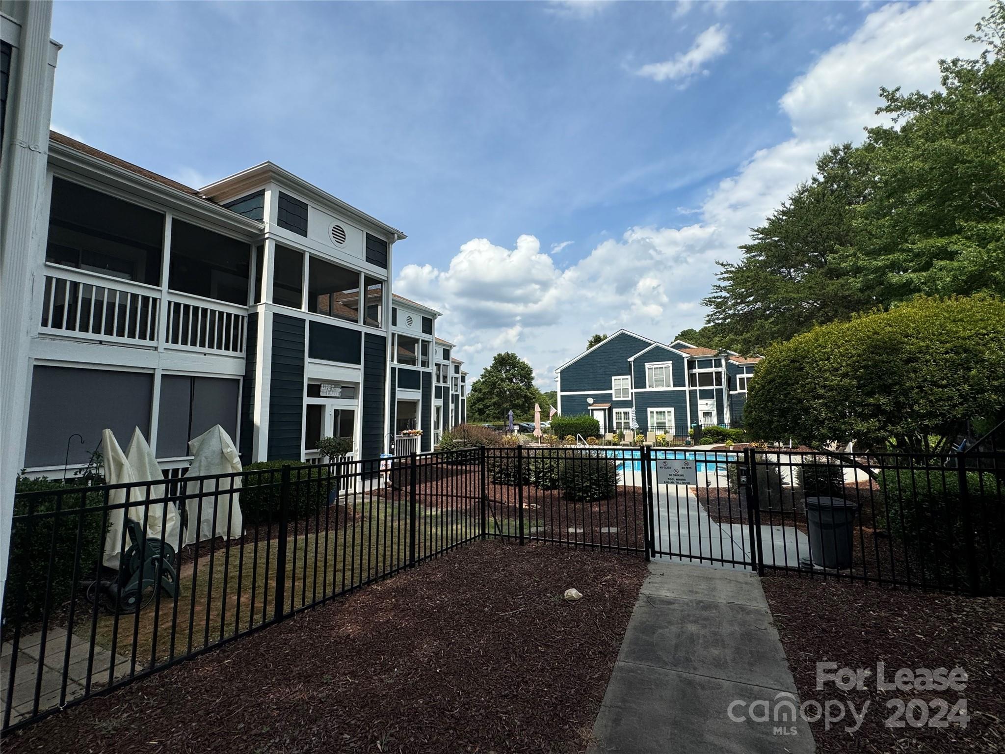17542 Tuscany Lane Cornelius, NC 28031 - Photo 34 of 35 a view of a house with backyard and porch