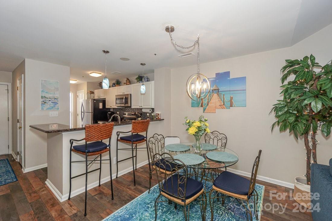 17542 Tuscany Lane Cornelius, NC 28031 - Photo 8 of 35 a view of a dining room with furniture