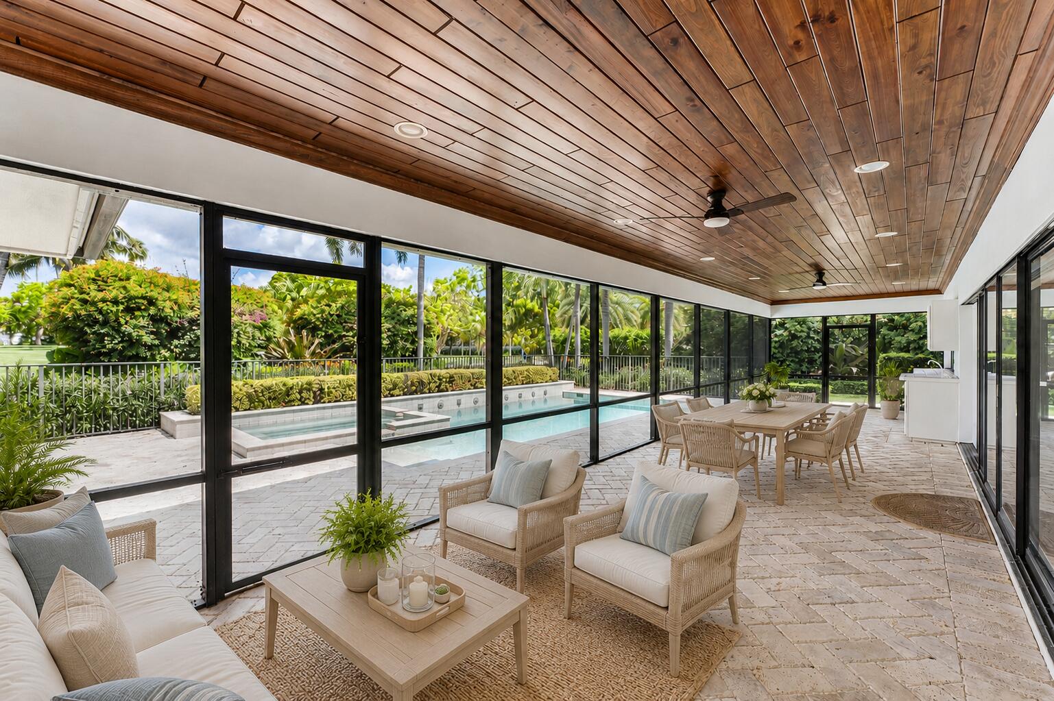 1851 Thatch Palm Drive Boca Raton, FL 33432 - Photo 45 of 70 a living room with furniture and a floor to ceiling window