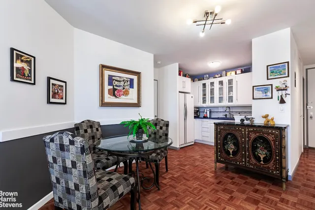 a picture of a book and a white bed