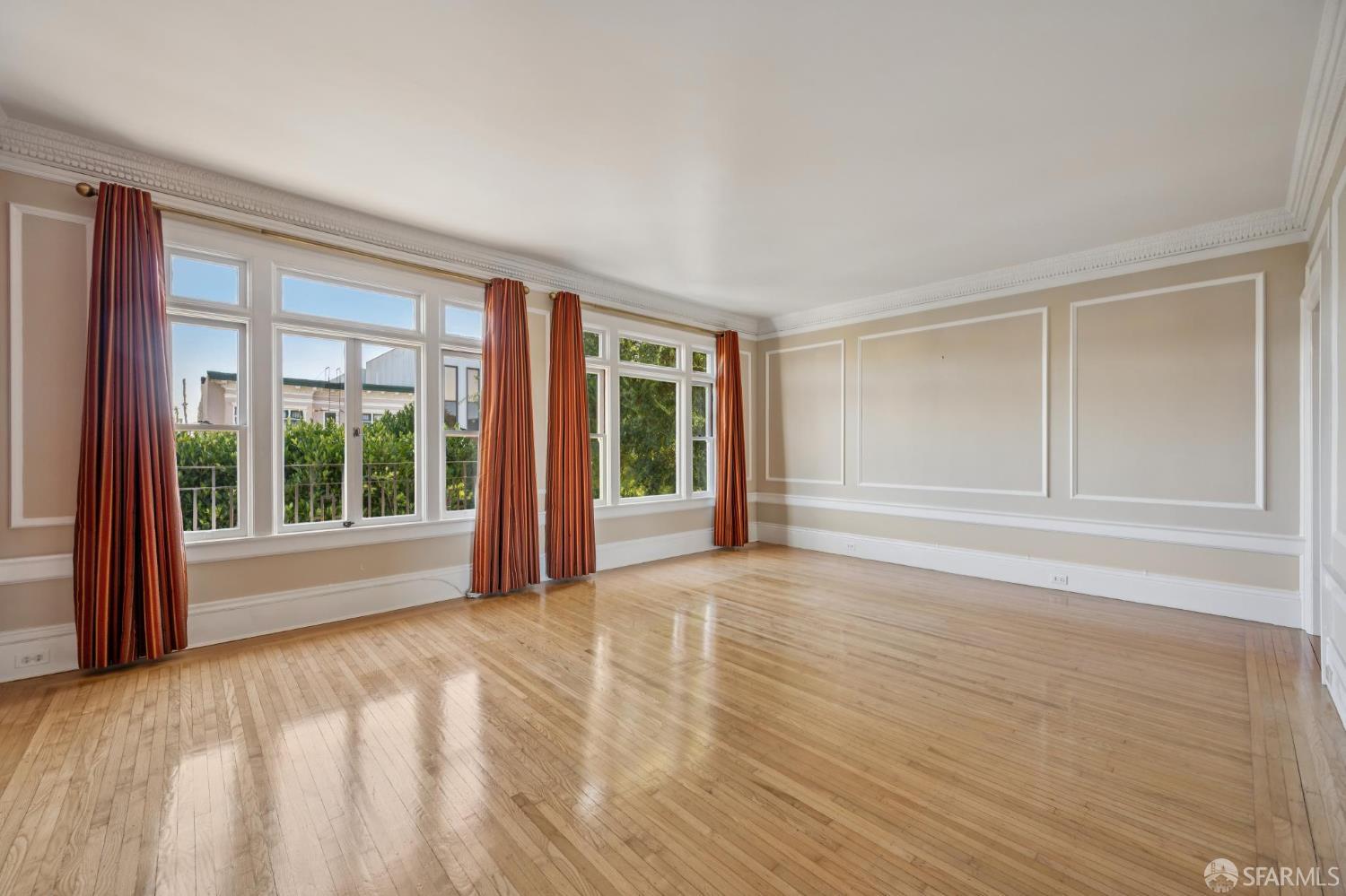 189 Commonwealth Avenue, Unit 3 San Francisco, CA 94118 - Photo 11 of 25 a view of an empty room with wooden floor and a window