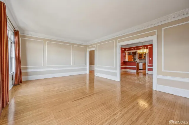 a bathroom with a toilet a sink shower and mirror