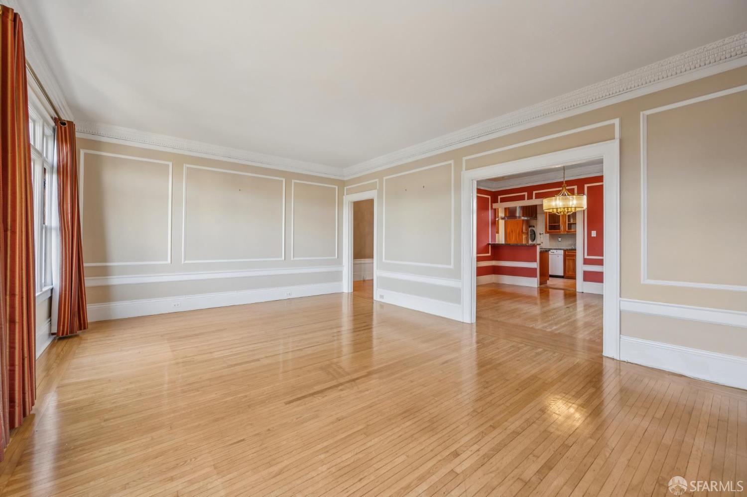 189 Commonwealth Avenue, Unit 3 San Francisco, CA 94118 - Photo 12 of 25 a view of an empty room with wooden floor and a window