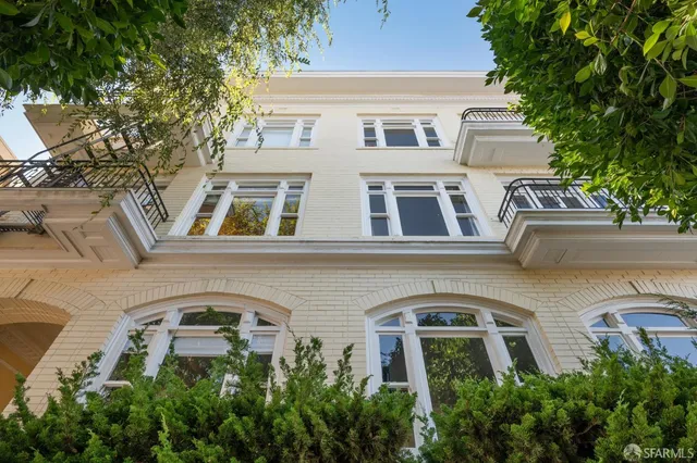 a front view of a house with large windows