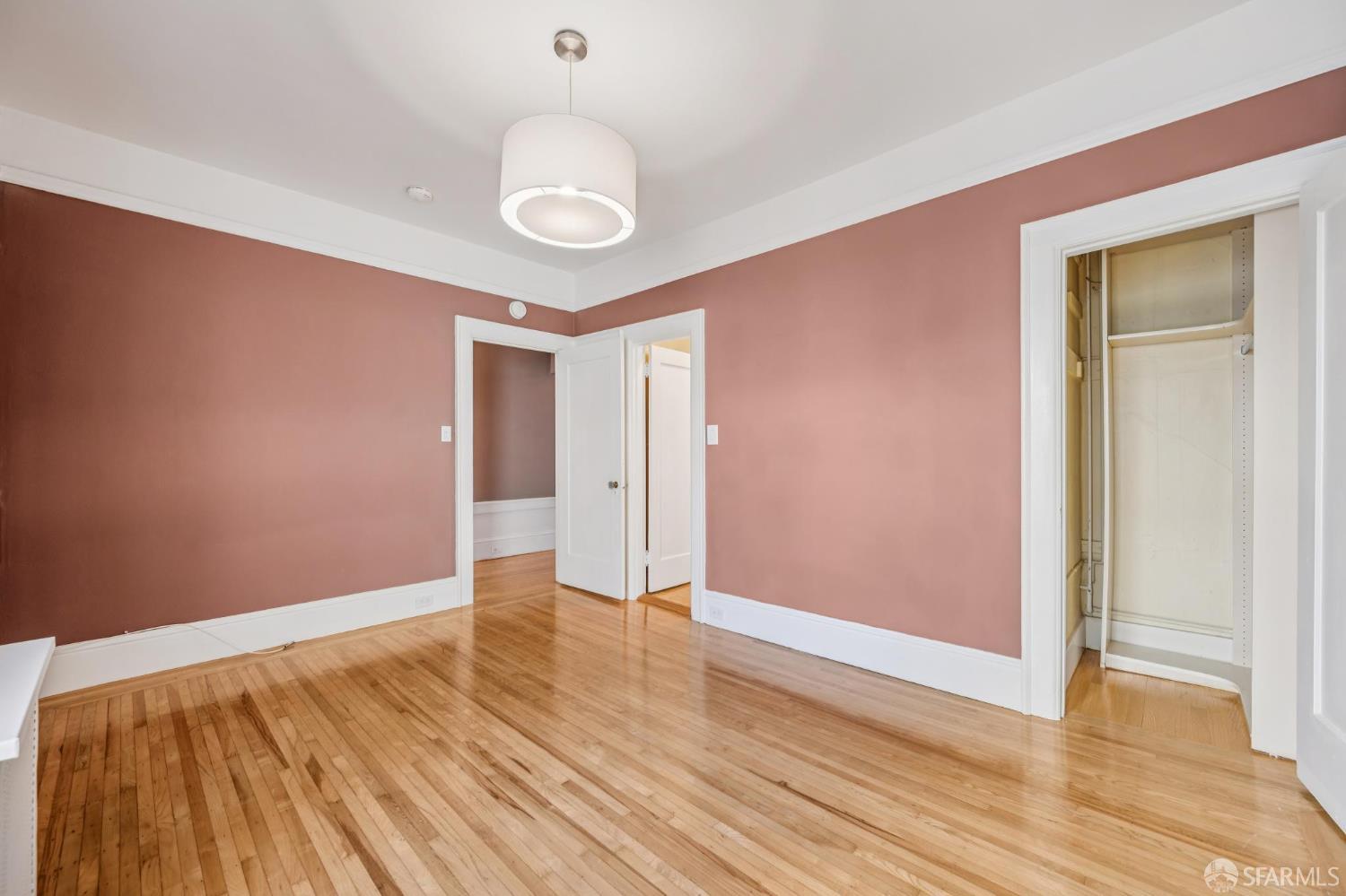 189 Commonwealth Avenue, Unit 3 San Francisco, CA 94118 - Photo 21 of 25 a view of an empty room with wooden floor