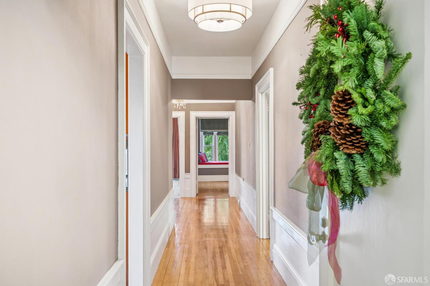 189 Commonwealth Avenue, Unit 3 San Francisco, CA 94118 - Photo 5 of 25 a view of a hallway with wooden floor and a potted plant