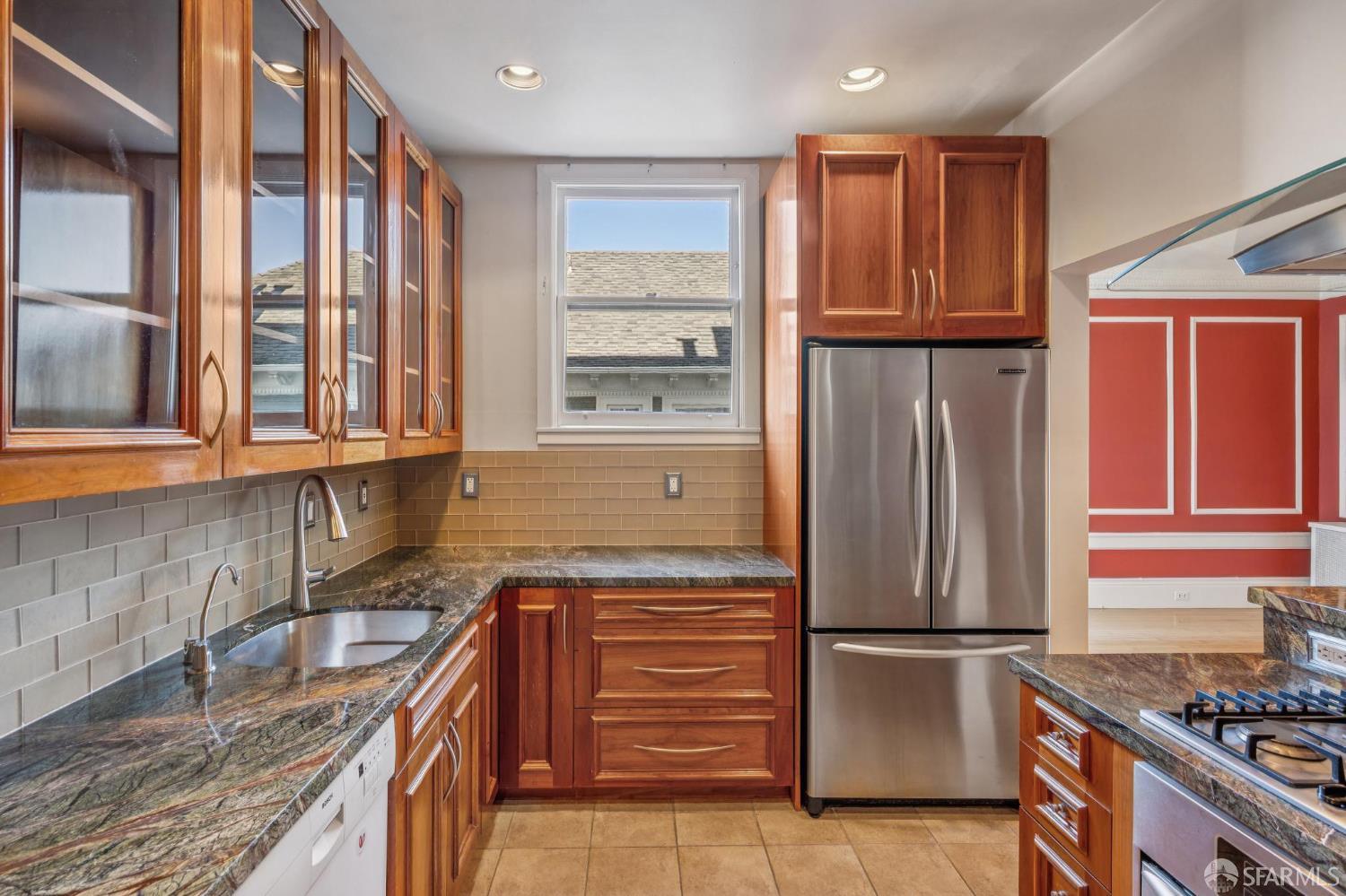 189 Commonwealth Avenue, Unit 3 San Francisco, CA 94118 - Photo 8 of 25 a kitchen with granite countertop a refrigerator and a sink