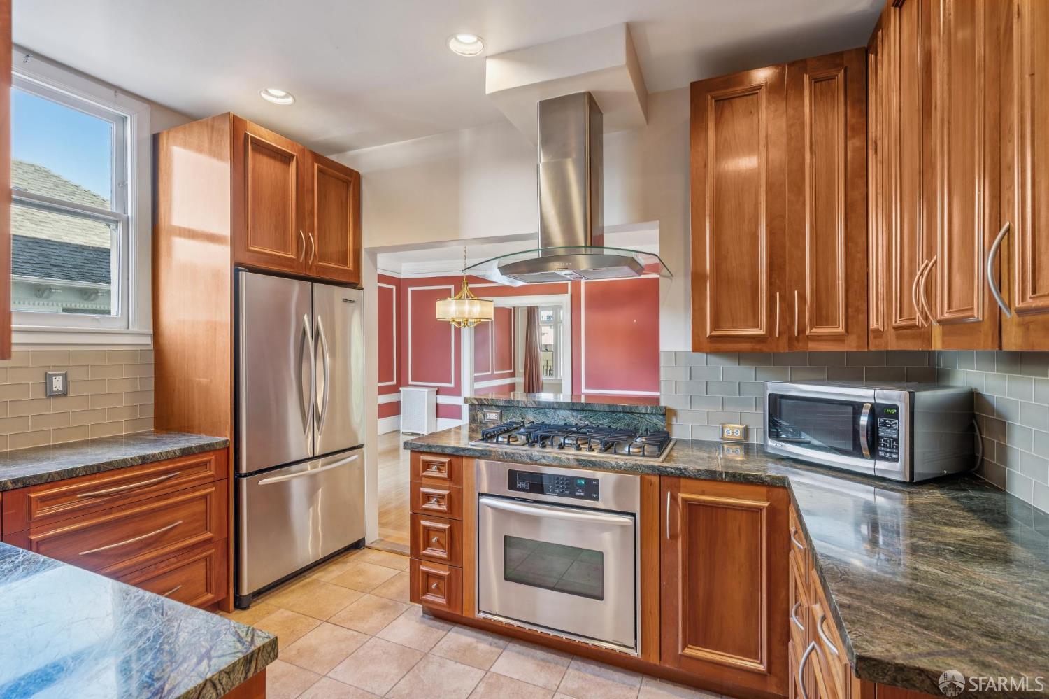 189 Commonwealth Avenue, Unit 3 San Francisco, CA 94118 - Photo 9 of 25 a kitchen with stainless steel appliances granite countertop a refrigerator and a stove top oven