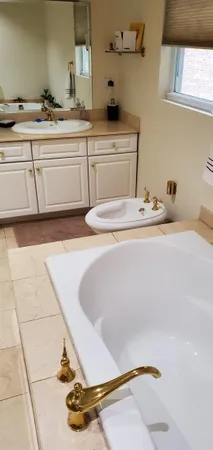 a room with a sink and cabinets