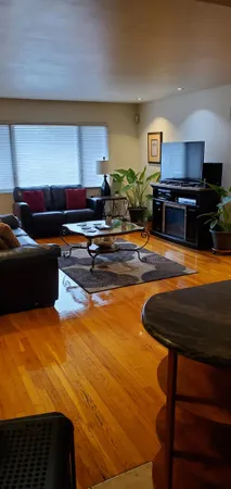 a kitchen with stainless steel appliances kitchen island granite countertop a sink and a stove