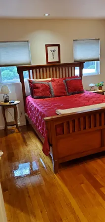 a bedroom with a bed and window