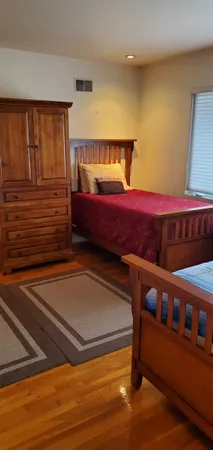 a bedroom with furniture and a window