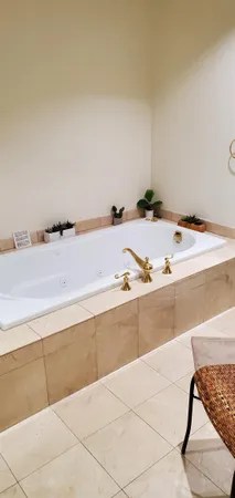 a view of a kitchen with a sink and a refrigerator