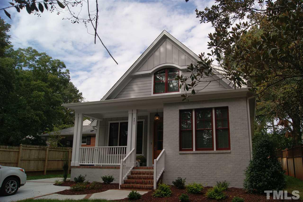 a front view of a house with garage
