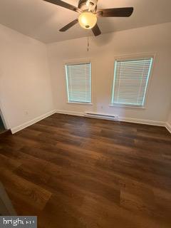 7717 Pearsons Corner Road Dover, DE 19904 - Photo 7 of 17 a view of an empty room with window and wooden floor