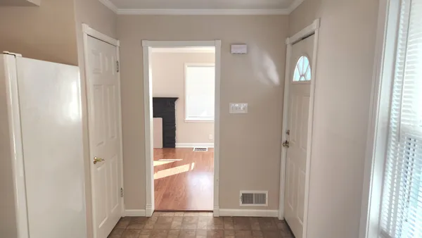 a view of a bathroom with a glass door and shower