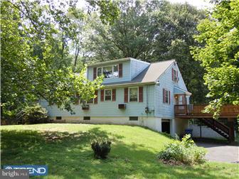 99 Warden Road Doylestown, PA 18901 - Photo 4 of 11 a front view of house with yard and green space