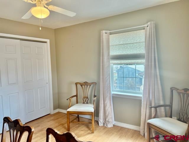 2010 Rolling Road Cortez, CO 81321 - Photo 13 of 21 a view of a room with furniture and wooden floor