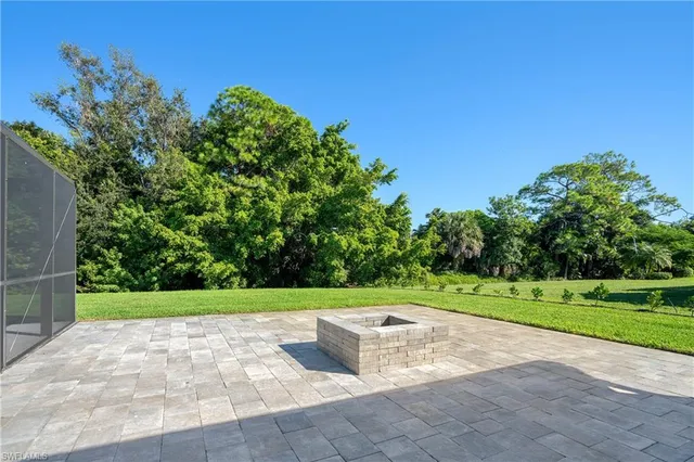 a view of a swimming pool with a yard