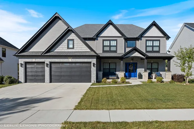 front view of a house with a yard